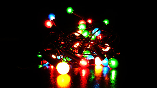 lit string lights in dark room thumbnail