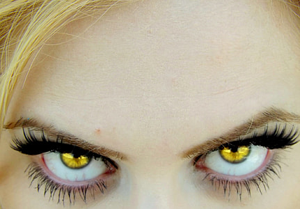 photo of woman's yellow contact lens thumbnail