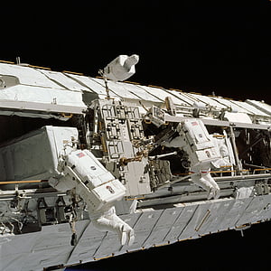 two white astronauts fixing a space ship thumbnail