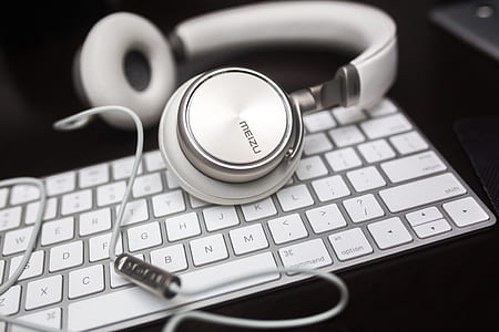 white Meizu corded on-ear headphones on keyboard thumbnail