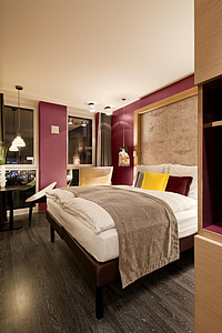 bed beside glass wall thumbnail