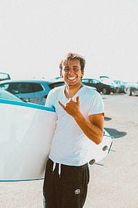 Photo of Person Holding Surfboard thumbnail