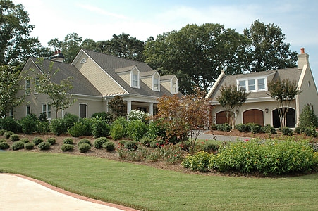 gray and white house on green grass lawn thumbnail