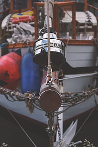 white and brown boat floating thumbnail
