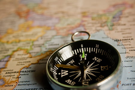 closeup photo of silver-colored compass thumbnail