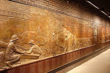 brown wooden wall with sculptures thumbnail