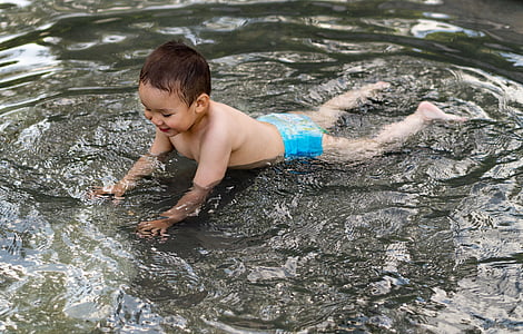 toddler playing on a body of water thumbnail