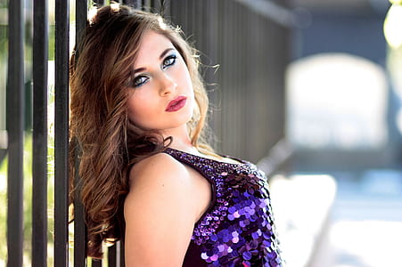 woman wearing purple sequinned tank top thumbnail