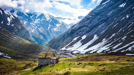 gray and green house on mountain thumbnail