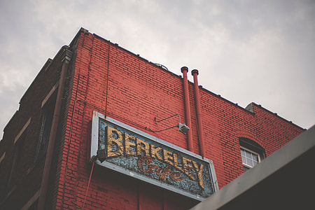 Berkeley signage mounted on red concrete building thumbnail