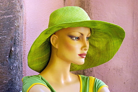 green hat and green dress on mannequin thumbnail