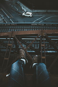 person on brown metal tower at daytime thumbnail