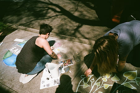 two person doing paintings thumbnail
