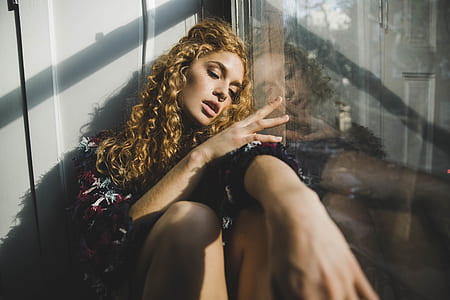 woman leaning on glass wall thumbnail