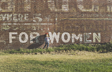 girl standing near for women printed wall thumbnail