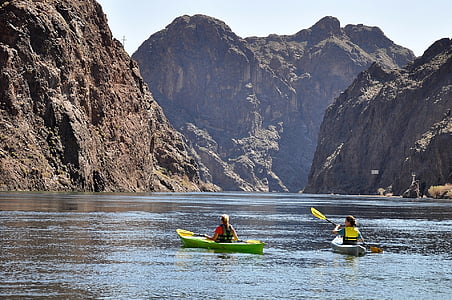 two people rowing on green and gray boats thumbnail