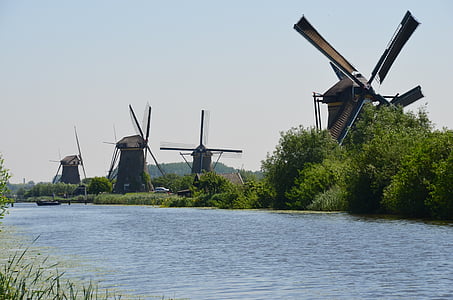 landscape photography of four windmills thumbnail