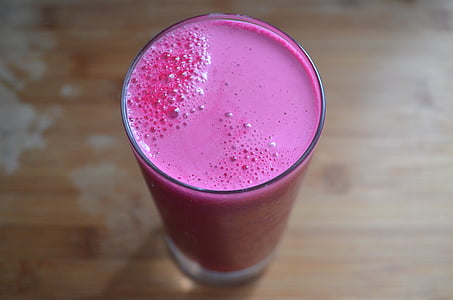 clear highball glass filled with pink liquid thumbnail