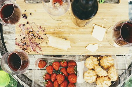 strawberry and liquor bottle on table thumbnail