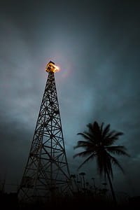 low angle photo of grey metal tower thumbnail