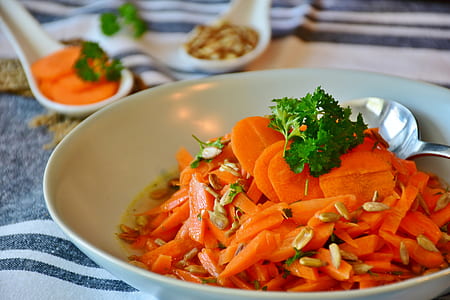 sliced carrots in white bowl thumbnail