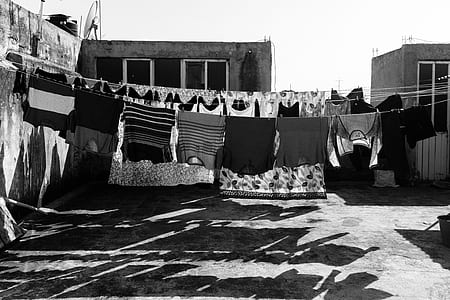 hanging clothes grayscale photo thumbnail