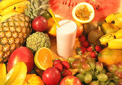 milk drink surrounded by assorted fruits thumbnail