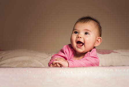 baby wearing pink long-sleeved shirt thumbnail