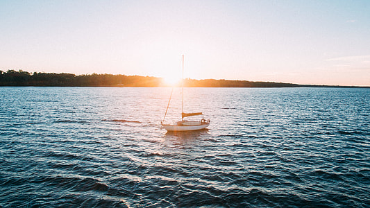 white boat on body of water thumbnail