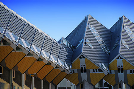 gray and brown concrete building under blue s thumbnail