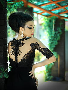 woman in black long-sleeved gown thumbnail