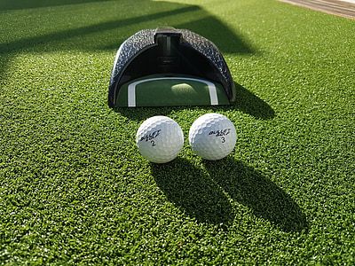 two white golf balls thumbnail
