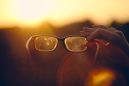 person holding reading glasses thumbnail