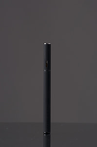 black vaporizer on black surface thumbnail