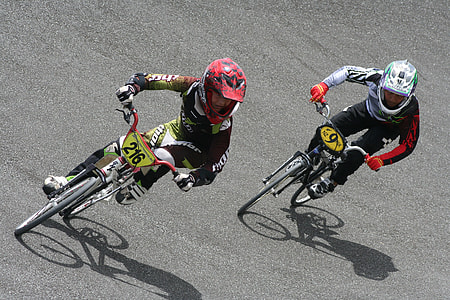 two cyclist riding on bikes thumbnail