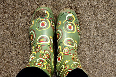 pair of green-and-brown rain boots thumbnail