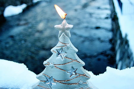 selective-focus photography of lit white Christmas tree candle thumbnail