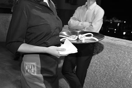 woman holding serving tray thumbnail