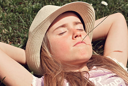 girl wearing pink shirt and beige hat thumbnail