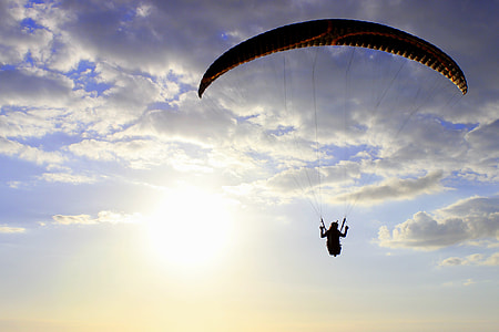 person with paragliding during daytime thumbnail