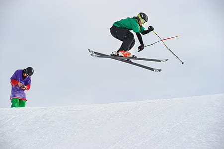 man in green shirt skiing thumbnail