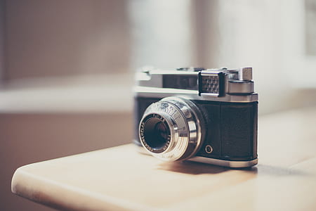 depth of field photography of black and gray camera thumbnail