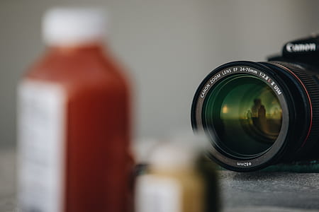 selective focus photography of Canon DSLR camera thumbnail