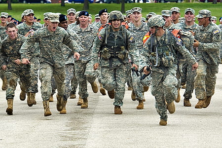 army running on concrete road during daytime thumbnail