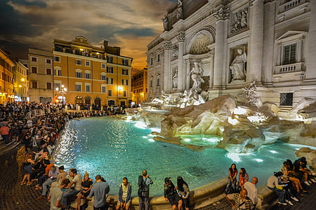 people sitting near water fountain thumbnail