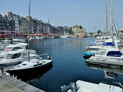 boats near dock during daytime thumbnail