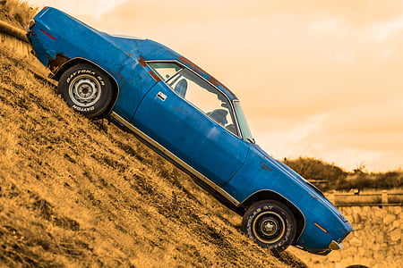 selective photo of blue muscle car during daytime thumbnail