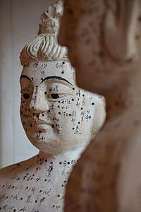 selective focus photography of white concrete Buddha statue thumbnail