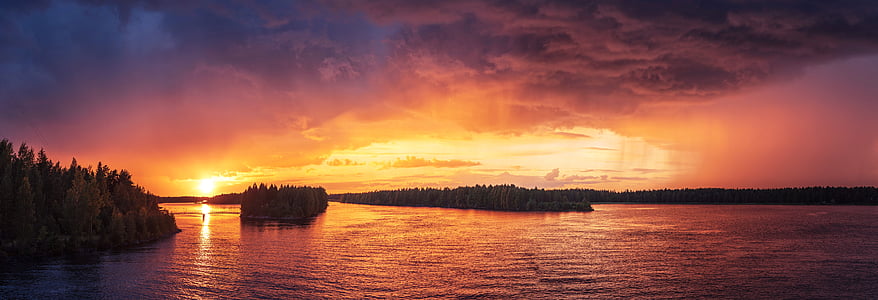 panoramic photography of body of water during sunset thumbnail
