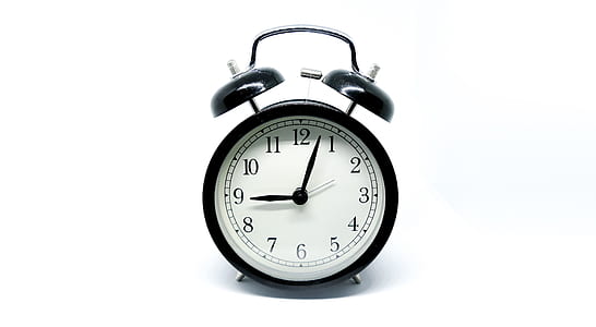 black twin-bell alarm clock displaying 9:03 thumbnail